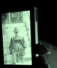 a person holding a cell phone in the dark